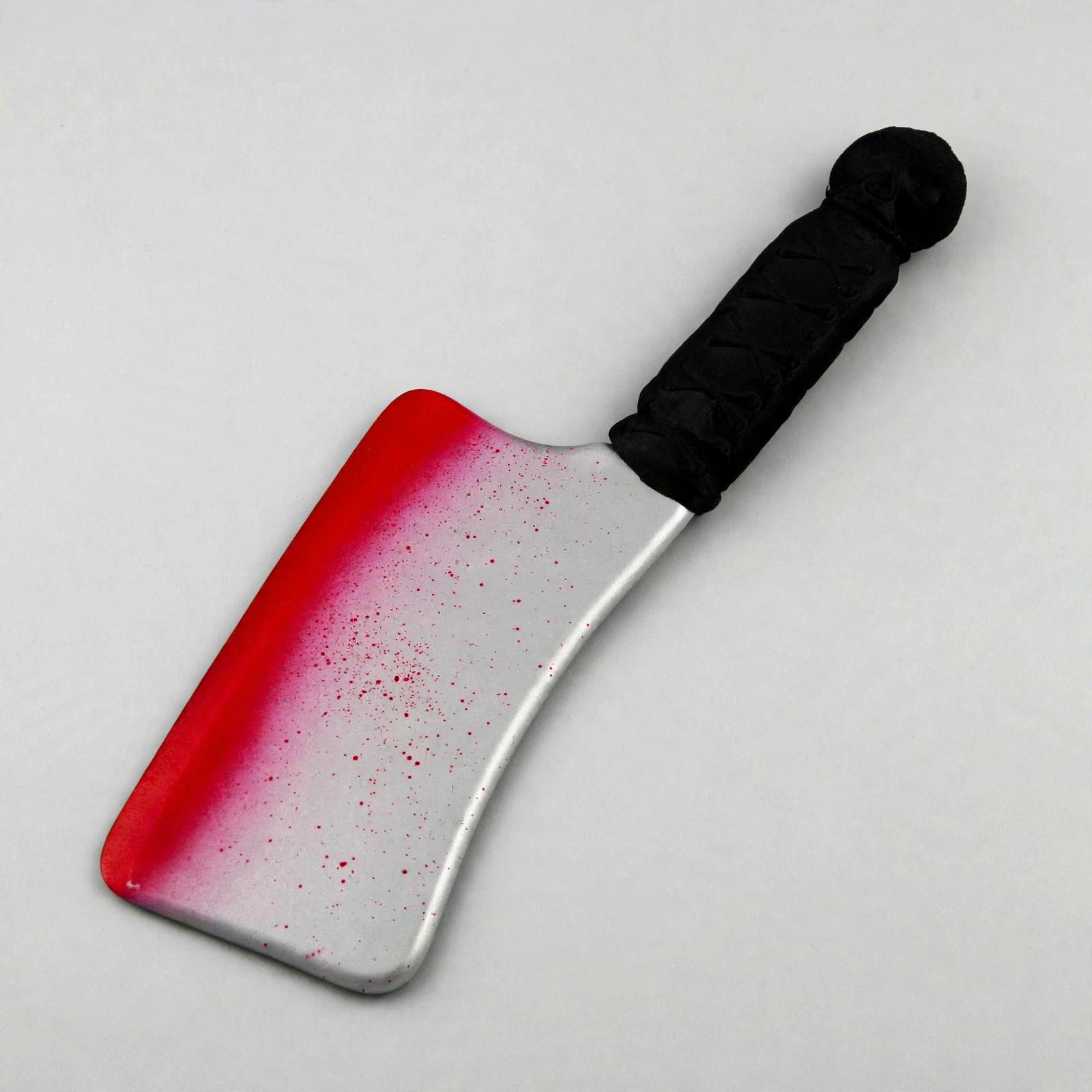 Blooded Cleaver Halloween Prop Angled View Blooded cleaver Halloween prop at three-quarter angle showing blade and handle