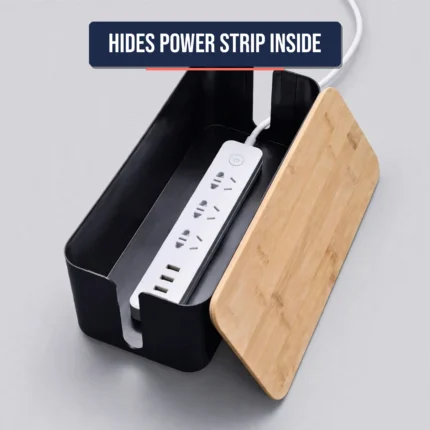 Cable management box at an angle with bamboo lid ajar showing power strip inside