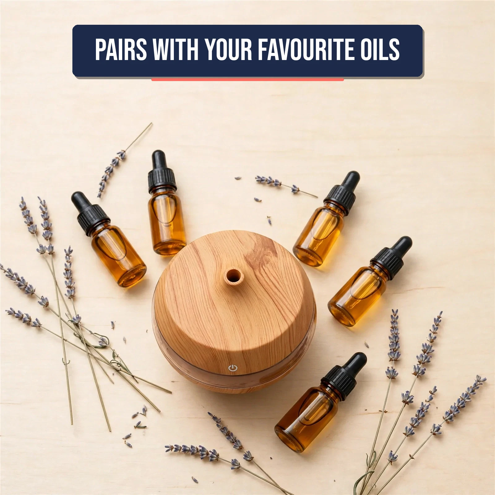 Flat lay of the essential oil diffuser with essential oil bottles and dried lavender
