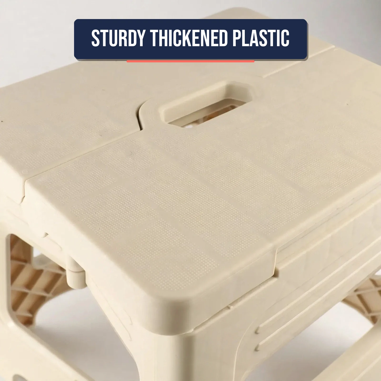 Close-up of the carry handle and step surface of the folding step stool