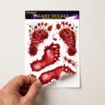 Hand peeling a bloody footprint decal showing easy application