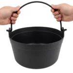 Cauldron bucket held showing scale and size