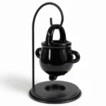 Black cauldron oil burner from a three-quarter angle showing the tealight dish base