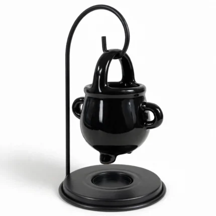 Black cauldron oil burner from a three-quarter angle showing the tealight dish base