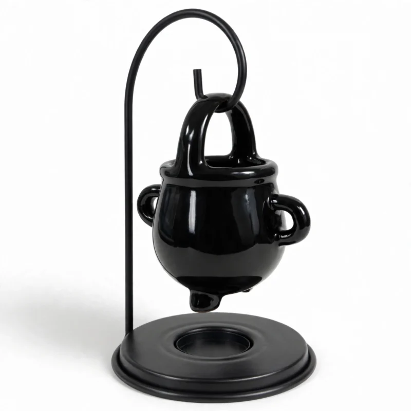 Black cauldron oil burner from a three-quarter angle showing the tealight dish base
