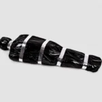 Scary fake corpse in black bag Halloween prop, front view