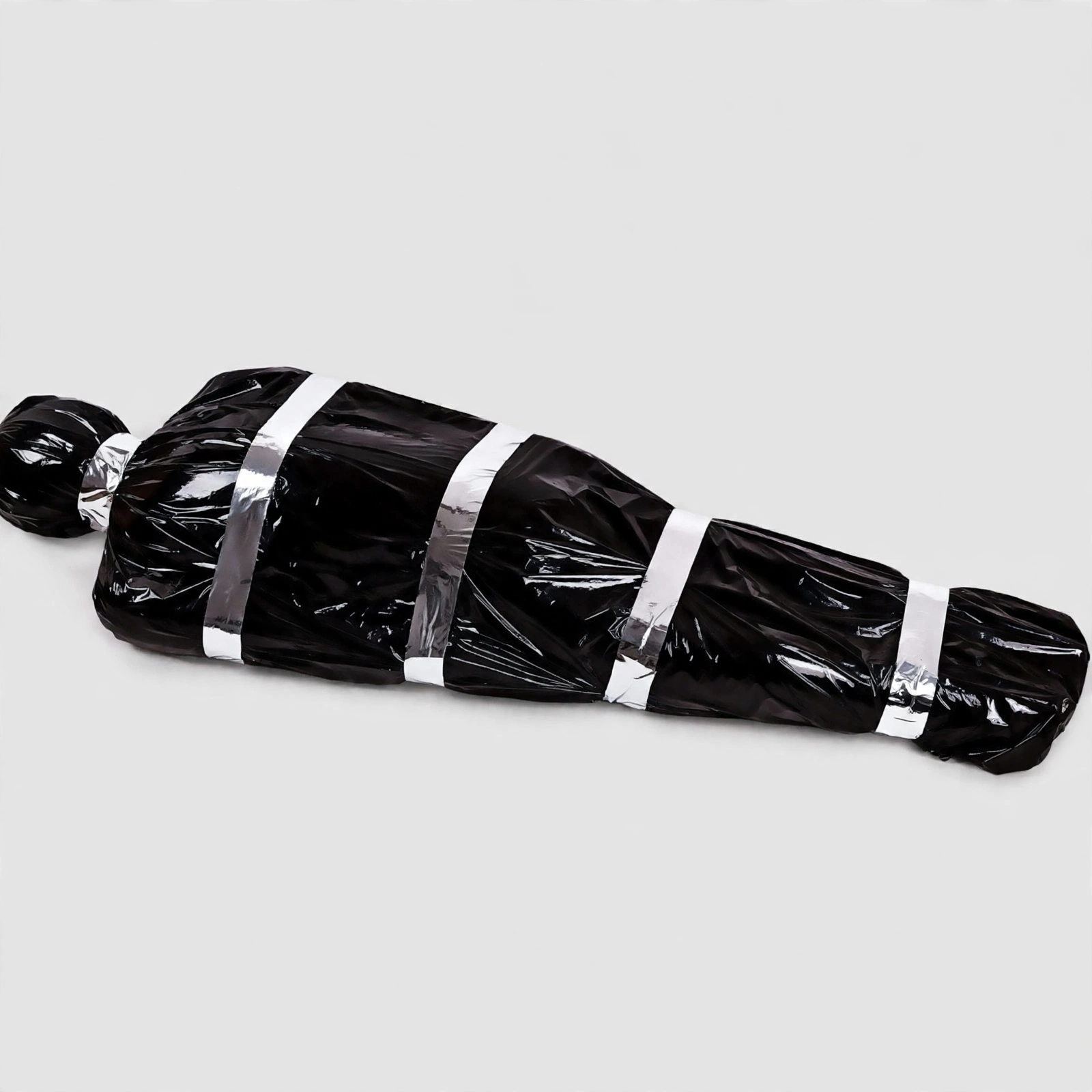 Scary Fake Corpse in Bag Halloween Prop Front View Scary fake corpse in black bag Halloween prop, front view
