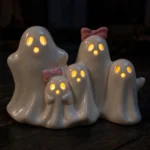 Ghost figurines glowing in a dark room with LED eyes lit up