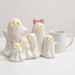 Ghost figurine set shown to scale next to a standard mug