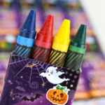 Close-up of the Halloween mini crayon pack sleeve and chunky wax crayons