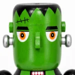 Close-up of the Frankenstein nutcracker face showing stitch marks and neck bolts