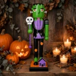 Four Halloween nutcracker designs lined up on a mantel with pumpkins