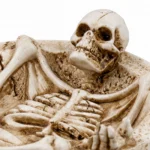 Close-up of the skull and ribcage detail on the skeleton ashtray