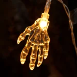 Close-up of a glowing skeleton hand LED bulb