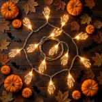 Flat lay of the skeleton hand LED string lights with Halloween decorations