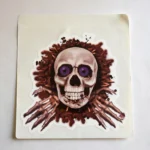 Close-up of the bloody skull print with purple eyes on the Halloween toilet decal
