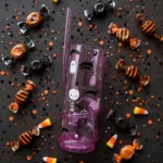 Flat lay of the Halloween spiral straw tumbler with party treats