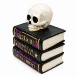 Stacked Halloween books with skull from a three-quarter angle showing the page edges