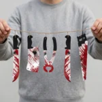 Person holding the Halloween torture tool garland to show its 180cm length