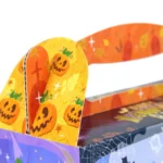 Close-up of the carry handle on a large Halloween treat box