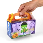 Hand holding a large Halloween treat box showing its generous size
