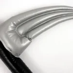 Close-up of the silver curved blade on the inflatable Halloween scythe