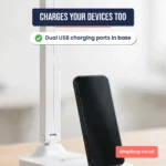 Close-up of the LED desk lamp base with a phone charging from its USB port