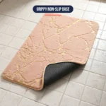 Non slip bath mat at an angle showing the plush top and grippy rubber backing