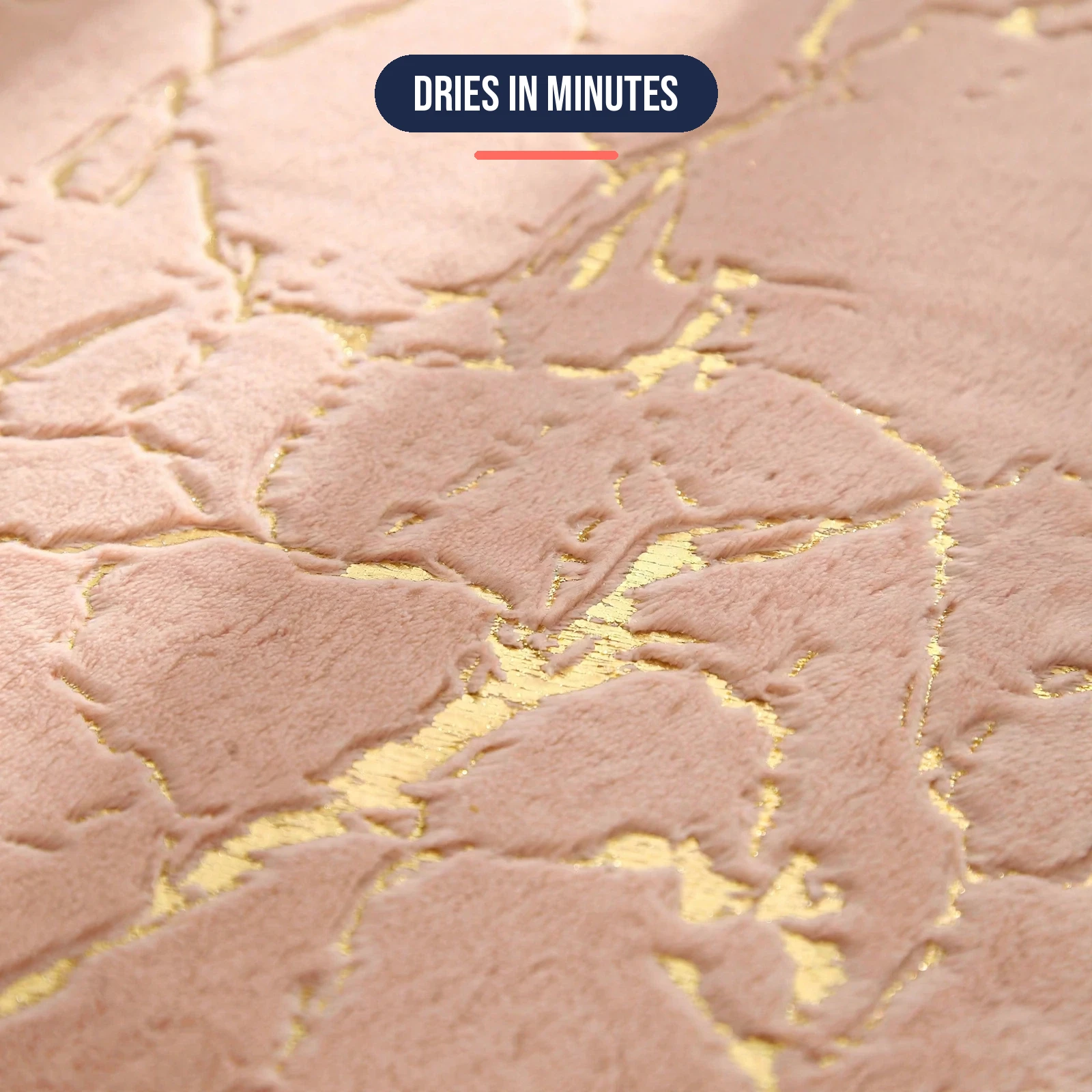 Close-up of the plush microfiber pile and gold marble pattern of the non slip bath mat