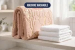 Non slip bath mat folded showing its slim flexible profile on a bathroom shelf