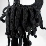 Close-up of the knitted tentacle strands on the beanie