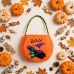 Flat lay of the orange Halloween bag with autumn decorations