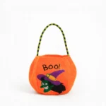 Orange fabric Halloween trick or treat bag with BOO print and witch design, front view