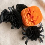 Close-up of the paper bat, pumpkin and spider cut-out details