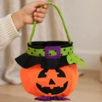 Pumpkin candy tote bag held beside a ruler to show its size