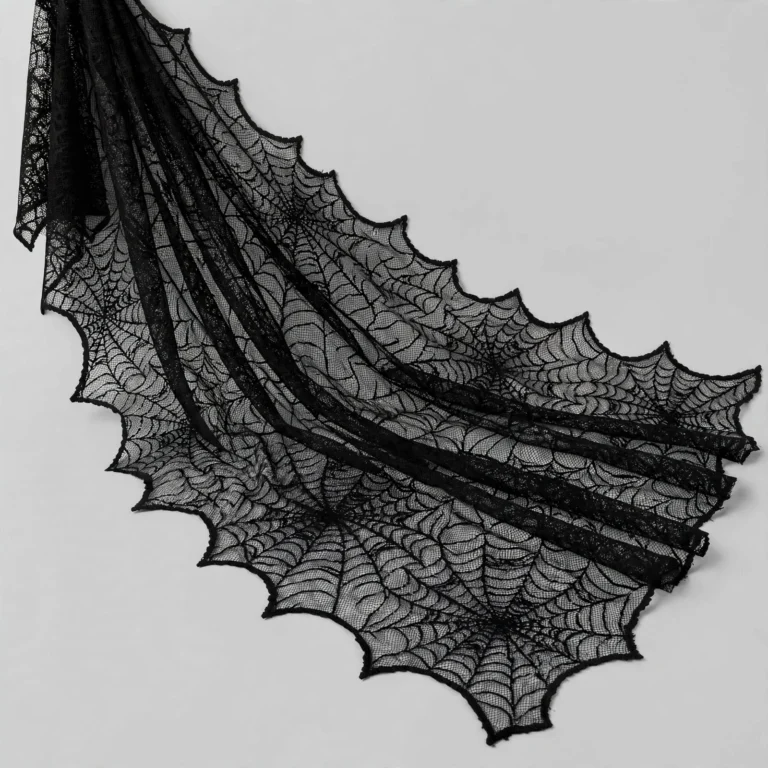 Black lace spider web cloth at an angle showing drape
