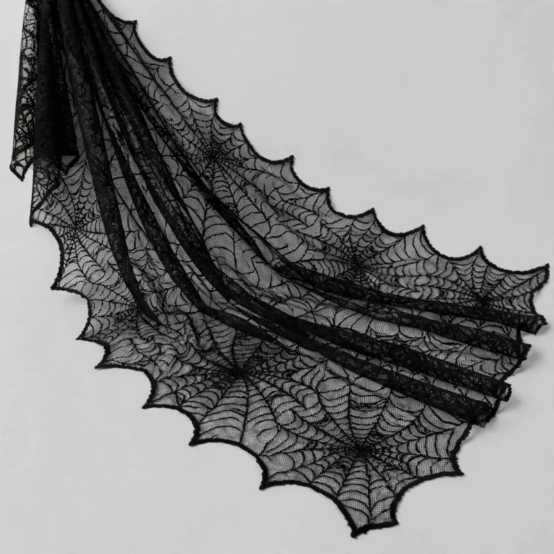 Black lace spider web cloth at an angle showing drape