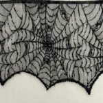 Close-up of the cobweb lace pattern and scalloped edge