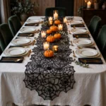 Black lace spider web runner on a set Halloween dinner table