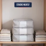 Three grey under bed storage bags stacked neatly on a wardrobe shelf