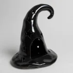 Ceramic witch hat tealight holder, three-quarter angle view