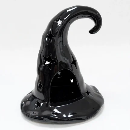 Black ceramic witch hat tealight candle holder with star cut-outs, front view
