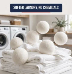 Wool dryer balls tumbling over folded white towels in a bright laundry room